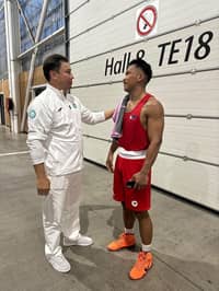 FORMER world champion Gennady Golovkin (left) cheers up Eumir Marcial after losing to Turabek Khabibullaev of Uzbekistan in the men’s 80-kilogram event of the Paris Olympics.